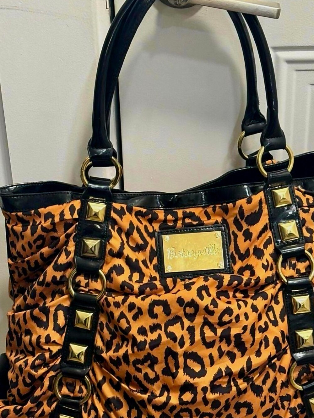 Betseyville, Johnson Orange and Black Leopard Print Studded Tote
